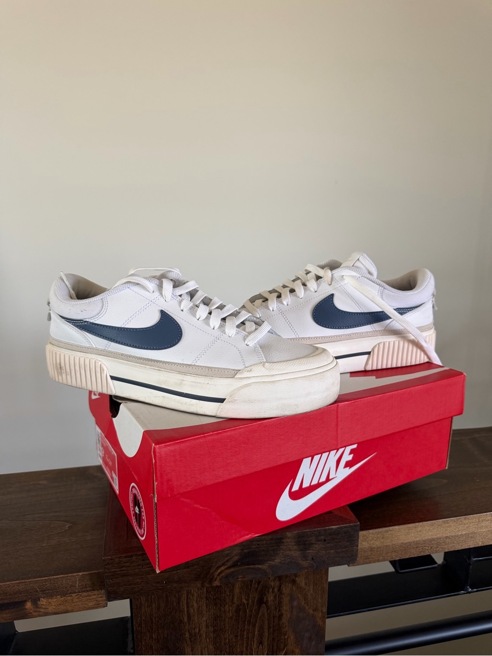 Nike White Low-Top Sneakers with Navy Swoosh